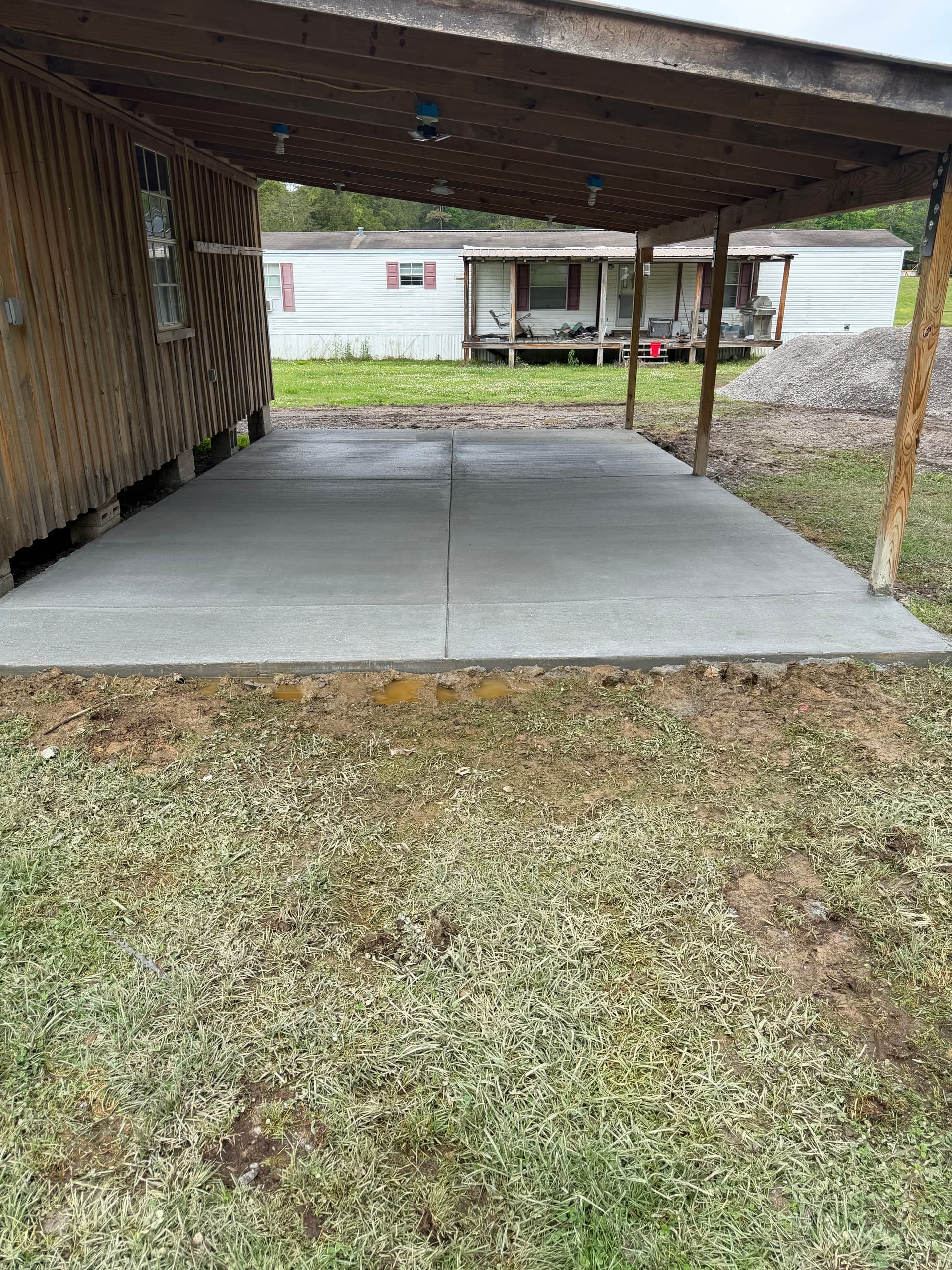 25x15 Concrete Slab Poured for a Tractor Work Space image